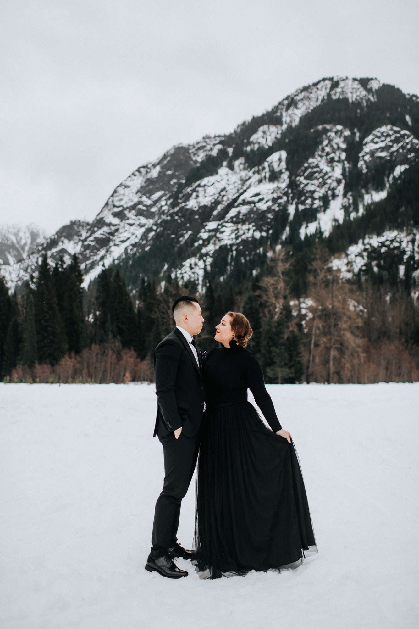 couple in formal attire out in the snow