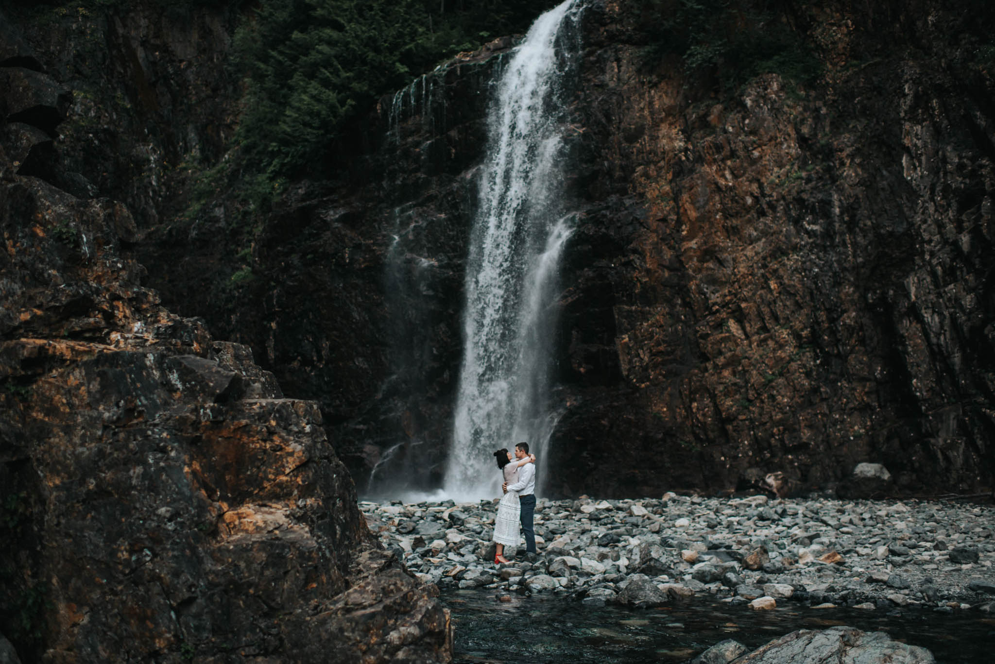 This is a photo of an adventurous couple during their Franklin Falls Engagement Session