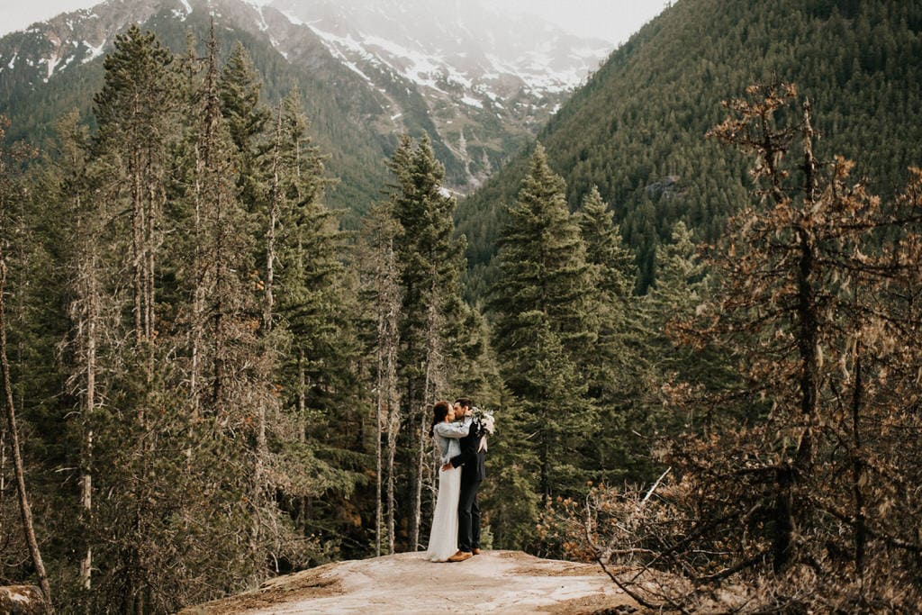 bride and groom hiking knob creek trail for their diablo lake elopement