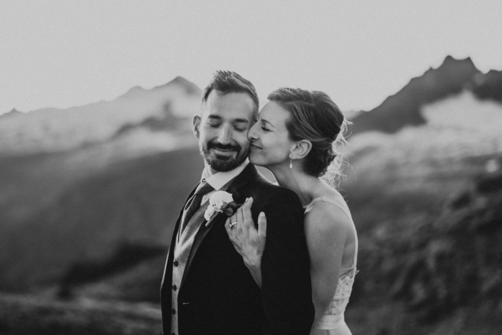 black and white photo of a bride and groom in the mountains