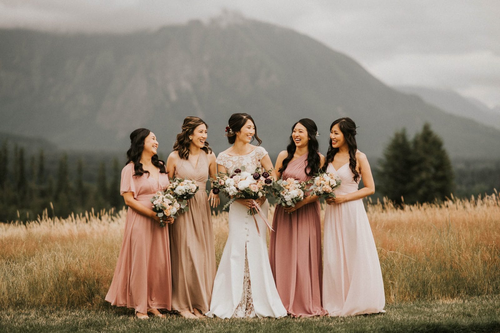 bridesmaids looking at each other and laughing