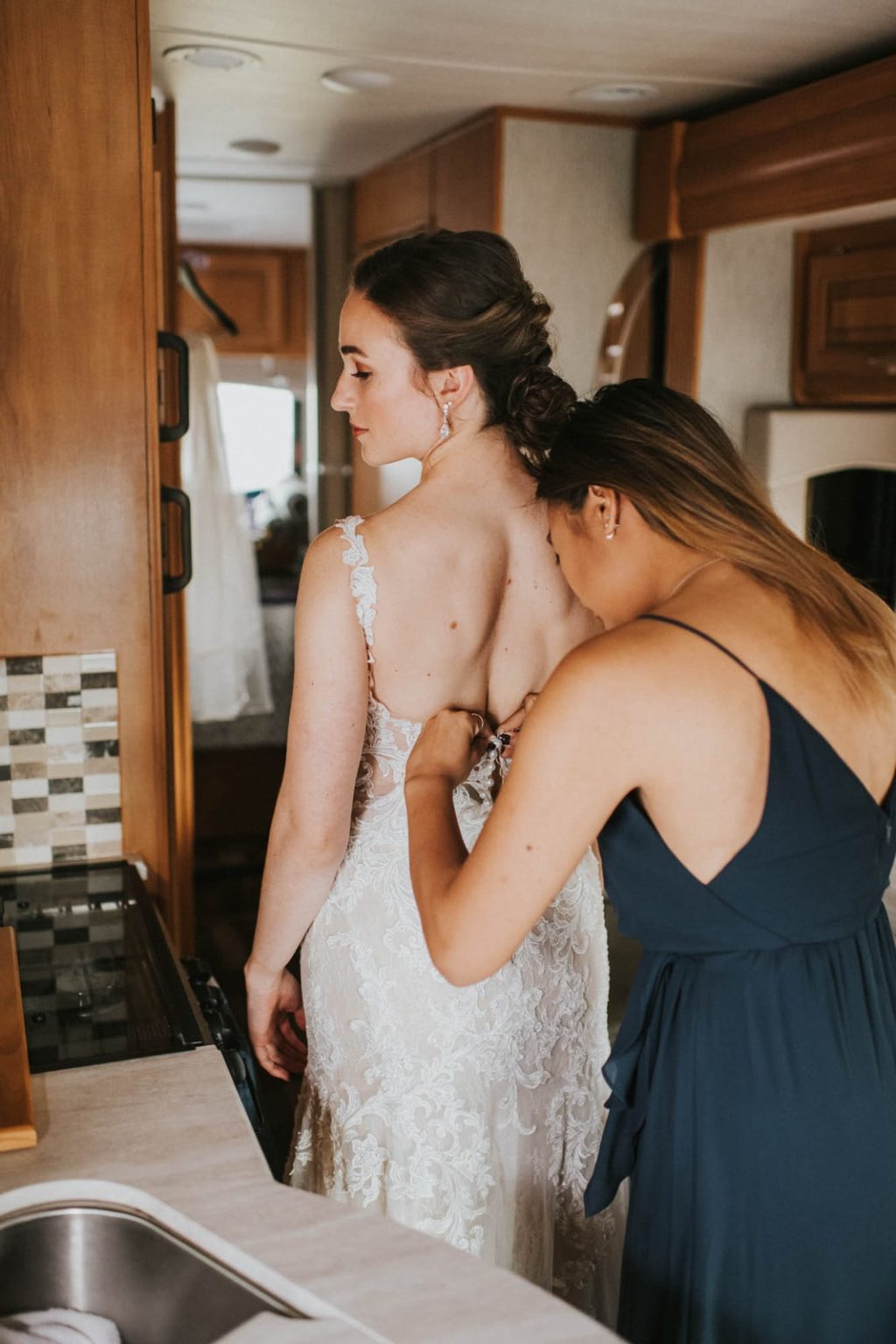 Bride getting her dress on